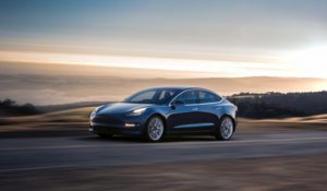 Model_3_Tesla_Blue_Driving.jpg